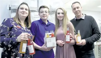  ?? TIFFANY MAYER/SPECIAL TO POSTMEDIA NETWORK ?? Heidi, Lucas, Emily and Michael Price are the family behind Two Siblings Kombucha, a St. Catharines startup that’s funding Emily and Lucas’s university tuition fund.