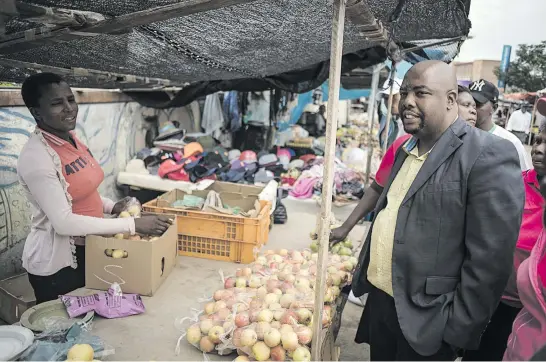  ?? Picture: Jacques Nelles ?? Newly elected mayor of Tshwane Stevens Mokgalapa during a walkabout yesterday in Marabastad where he interacted with informal traders.