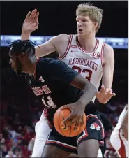  ?? (NWA Democrat-Gazette/Andy Shupe) ?? Arkansas forward Connor Vanover defends Gardner-Webb forward Kareem Reid in the first half of Saturday’s game at Walton Arena in Fayettevil­le. Vanover finished with a team-high 19 points along with 7 rebounds and 3 blocks in the No. 16 Razorbacks’ 86-69 victory.