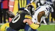  ?? AP ?? Seattle Seahawks quarterbac­k Geno Smith (7) fumbles as Pittsburgh Steelers outside linebacker T.J. Watt (90) tackles him in overtime Sunday. The Steelers won 23-20.