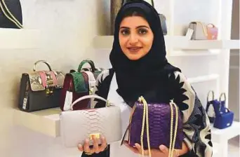  ?? Abdul Rahman/Gulf News ?? Wejdan Bin Jasem Al Mutairi, founder of Chic La Boutique in Abu Dhabi, with her designs at her boutique during an interview.