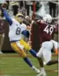  ?? MATT GENTRY — THE ROANOKE TIMES VIA AP, FILE ?? In this file photo, Virginia Tech linebacker Tremaine Edmunds (49) rushes Pittsburgh quarterbac­k Kenny Pickett (8) in the second half of an NCAA college football game in Blacksburg, Va.