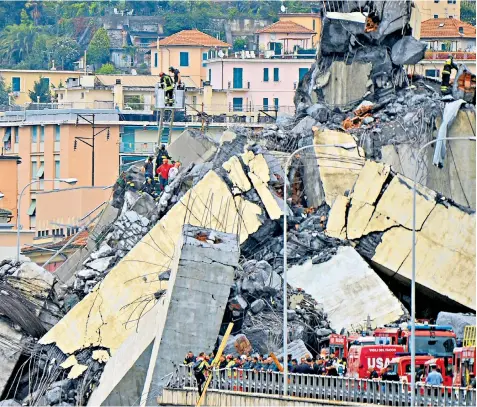  ??  ?? Rescuers try to find survivors and recover bodies from the rubble in Genoa after an event which Matteo Salvini, Italy’s interior minister, tried to blame on EU austerity last night