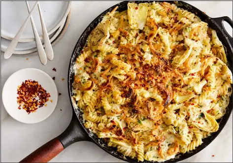  ?? RYAN LIEBE — THE NEW YORK TIMES ?? Baked Artichoke Pasta With Creamy Goat Cheese.