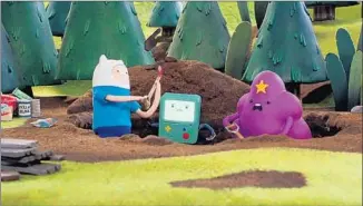  ?? Cartoon Network ?? FINN, BMO and Lumpy Space Princess make a shelter in “Bad Jubies” on the Cartoon Network.