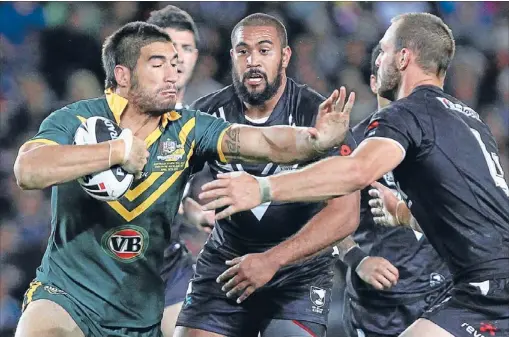  ?? Photo: PHOTOSPORT ?? Sparked up debate: New Zealander-turned-Aussie James Tamou, here being monstered by the Kiwis in April’s Anzac test, has re-ignited the eligibilit­y debate by encouragin­g New Zealand-born players to follow his example and choose Australia’s Origin over...