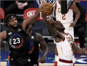  ?? ASSOCIATED PRESS ?? Cleveland Cavaliers’ Taurean Prince heads for the basket as New York Knicks’ Mitchell Robinson (23) defends during the first quarter of an NBA basketball game Friday, Jan. 29, 2021, in New York.