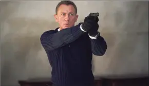  ?? Nicola Dove/Danjaq LLC/MGM / TNS ?? Daniel Craig as James Bond in “No Time to Die.”