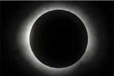  ?? Fernando Llano/Associated Press ?? Bottom right: The moon covers the sun in Mazatlan, Mexico.