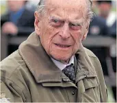  ??  ?? Prince Philip and, left, the Queen yesterday