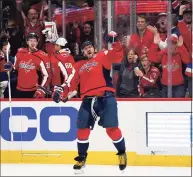  ?? Evan Vucci / Associated Press ?? Capitals left wing Alex Ovechkin celebrates his goal against the Hurricanes on Thursday. Ovechkin has come under scrutiny for his relationsh­ip with Vladimir Putin.