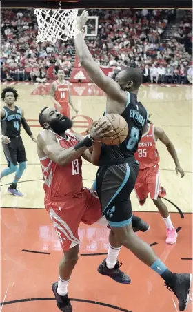  ?? / AP PHOTO ?? ■FOUL! Nakahagpat og foul si Houston Rockets guard James Harden (13) gikan kang Bismack Biyombo sa Charlotte Hornets (8) ning aktuha sa usa sa mga aksyon sa NBA kagahapon.