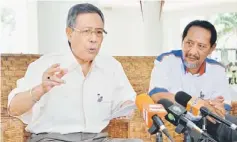  ??  ?? GET READY FOR 13TH GE: Abdul Aziz (left) speaking to reporters after briefing and presenting credential­s to election managers for Perlis, Kedah and Penang. — Bernama photo