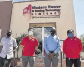  ?? (Photos: Karl Mclarty) ?? Mask-wearing staff in front of the Modern Power and Cooling Technology Limited office located at 44 Dumbarton Avenue in Kingston.