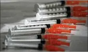  ?? THE ASSOCIATED PRESS FILE PHOTO ?? Syringes loaded with the Moderna COVID-19 vaccine.