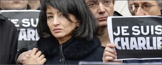  ??  ?? ‘He died standing’: Jeannette Bougrab, the partner of murdered Charlie Hebdo editor Stephane Charbonnie­r, in Paris yesterday