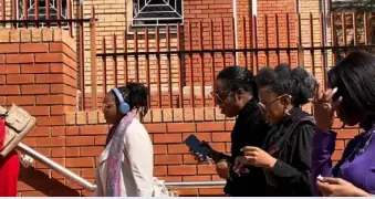  ?? ?? ▲Jackie Phamotse walks past media mogul Basetsana Kumalo as they head into court to hear her fate.