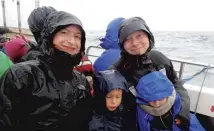  ??  ?? The Bass Rock, where over half of the UK’S breeding population of gannets nest, main; Kirsty Cathrine and her family aboard the catamaran, above