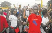  ?? THE ASSOCIATED PRESS ?? Supporters of former soccer player George Weah, presidenti­al candidate for the Coalition for Democratic Change, celebrate in Monrovia, Liberia, on Friday.