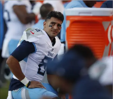  ?? DAVID ZALUBOWSKI - THE ASSOCIATED PRESS ?? Tennessee Titans quarterbac­k Marcus Mariota looks on from the sideline during the second half of an NFL football game against the Denver Broncos, Sunday, Oct. 13, 2019, in Denver.