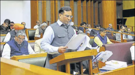  ?? KESHAV SINGH/HT ?? Haryana finance minister Capt Abhimanyu presenting the budget in the state assembly in Chandigarh on Friday.