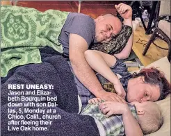  ??  ?? REST UNEASY: Jason and Elizabeth Bourquin bed down with son Dallas, 5, Monday at a Chico, Calif., church after fleeing their Live Oak home.