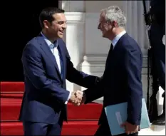  ??  ?? Greek Prime Minister Alexis Tsipras (left) welcomes French Economy Minister Bruno Le Maire at Maximos Mansion in Athens, on Thursday. Macron arrives in Greece on a two-day official visit expected to focus on Greece’s financial crisis. AP PHOTO