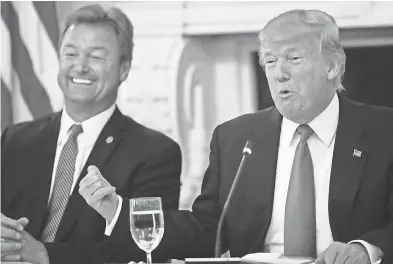  ?? PABLO MARTINEZ MONSIVAIS/AP ?? For Republican candidates including Nevada’s Sen. Dean Heller, cozying up to President Donald Trump has proven to be a successful political strategy this year.