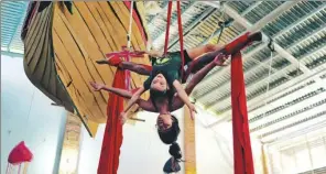  ?? PROVIDED BY REUTERS ?? A girl trains with an instructor at the Circo de los Ninos circus school in San Francisco, Mexico. The facility was set up by the world-famous Cirque du Soleil as a community project six years ago and now has a roll of 150 children.