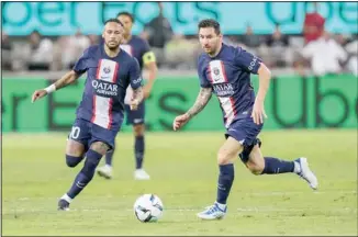 ?? ?? PSG’s Lionel Messi, (right), controls the ball as PSG’s Neymar runs during the French Super Cup final soccer match between Nantes and Paris Saint-Germain at Bloomfield Stadium in Tel Aviv, Israel. (AP)