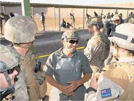  ?? Picture / NZDF ?? Ron Mark inspects Kiwi soldiers at Camp Taji training mission in Iraq.