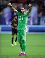  ?? The Associated Press Vancouver Whitecaps goalkeeper Maxime Crepeau celebrates after beating Los Angeles FC in Vancouver on Saturday. ??