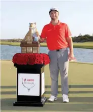  ?? (Getty Images/AFP) ?? Jon Rahm of Spain poses with the trophy after winning the Hero World Challenge at Albany, Bahamas.