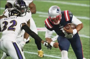  ?? Elise Amendola / Associated Press ?? Patriots quarterbac­k Cam Newton carries the ball as Ravens safety DeShon Elliott closes in for the tackle on Nov. 15.