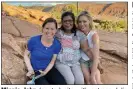  ?? (AP/Shaji John) ?? Minnie John (center) sits with actress Julie Bowen (right) and Bowen’s sister, Dr. Annie Luetkemeye­r, after the pair cared for John after she fainted and hit her head on a rock while stopping to rest in Arches National Park, Utah, last week.