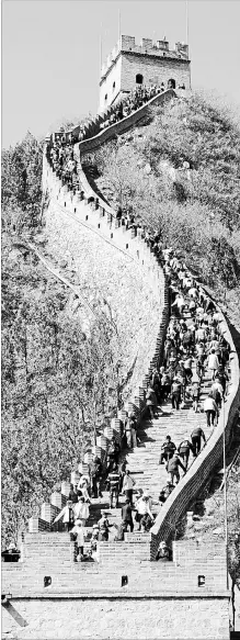  ?? JEROME LEVINE TNS ?? Tourists ascend steps on the Great Wall at Juyong Pass. A loosening of visa restrictio­ns has made travelling in the region easier.