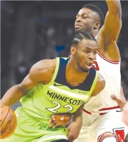  ??  ?? Andrew Wiggins drives against David Nwaba during the first quarter Saturday night in Minneapoli­s. Nwaba played a team- high 34 minutes.
| HANNAH FOSLIEN/ AP