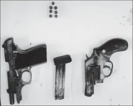  ??  ?? The firearms and ammunition that were found