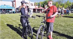  ?? NEW MEXICAN FILE PHOTO ?? Shawnee Romo and her husband, Anthony Romero, enjoy cold beers before a bike ride during the Outside Bike &amp; Brew festival in May 2016. This year’s event will be held Saturday and Sunday at Glorieta Camps.