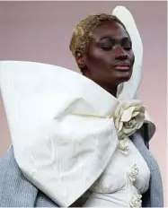  ??  ?? Models present creations by Thom Browne before the 2018/2019 fall/winter collection fashion show in Paris. Browne’s collection made a stunning statement about female strength and sexuality.