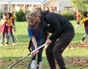  ??  ?? BOTTOM RIGHT Not just a former internatio­nal umpire but also a retired Christchur­ch Premier club player, Karen shares her knowledge and skill with Addi Johnstone.