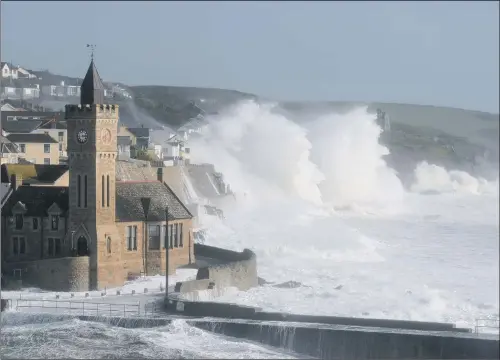  ?? PICTURE: BEN BIRCHALL. ?? NATURE’S POWER: Waves break around the church in the harbour at Porthleven, Cornwall, as Hurricane Ophelia hits the UK and Ireland.