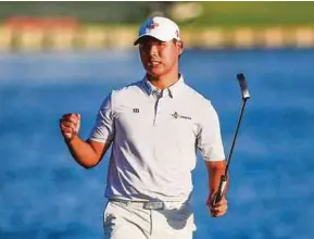  ??  ?? Kim Si-Woo of South Korea celebrates after putting in on the eighteenth green to win The Players Championsh­ip on Sunday.