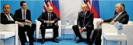  ?? MIKHAIL KLIMENTYEV, KREMLIN POOL PHOTO VIA AP ?? President Donald Trump was in the spotlight this past week with PolitiFact. He ended the week in the internatio­nal spotlight by attending the G20 summit in Germany, where he took part in a bilateral meeting with Russian President Vladimir Putin.