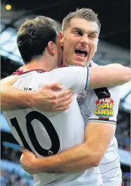  ?? Alex Livesey ?? Ashley Barnes celebrates with Sam Vokes after opening the scoring