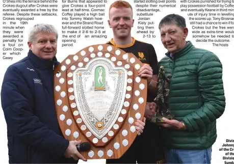  ??  ?? Weeshie Lynch, left, presenting the Division One Shield to Dr Crokes captain Johnny Buckley with Ger Galvin, on behalf of the Credit Union, presenting with the Man of the Match award after the County SFL Division 1 final at Lewis Road, Killarney on Sunday. Photo by Michelle Cooper Galvin