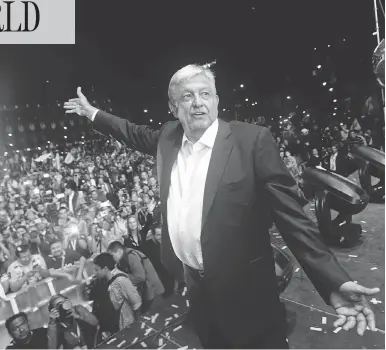  ?? PEDRO PARDO / AFP / GETTY IMAGES ?? Newly elected Mexican President Andres Manuel López Obrador, running for the “Juntos haremos historia” party, cheers his supporters at the Zocalo Square in Mexcio City Sunday after emerging victorious in the country’s election.