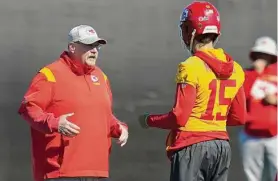  ?? Ross D. Franklin/Associated Press ?? Chiefs head coach Andy Reid, left, talks with quarterbac­k Patrick Mahomes during practice in Tempe, Ariz., on Friday. The Chiefs will play against the Philadelph­ia Eagles in Super Bowl 57 on Sunday.