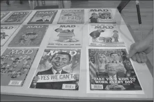  ?? The Associated Press ?? ARTISTICAL­LY MAD: A new exhibit celebratin­g the artistic legacy of MAD magazine that includes several examples of magazines over the years is displayed on Thursday in Columbus, Ohio.