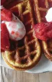  ??  ?? Norwegian waffles with strawberri­es and sour cream